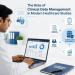 Indian doctor managing clinical data and healthcare study records on a laptop in a modern clinic